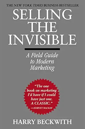Book cover of 'Selling the Invisible' by Harry Beckwith with a gray background and red badge.
