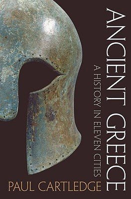 Book cover of 'Ancient Greece: A History in Eleven Cities' by Paul Cartledge with a helmet on a dark background.