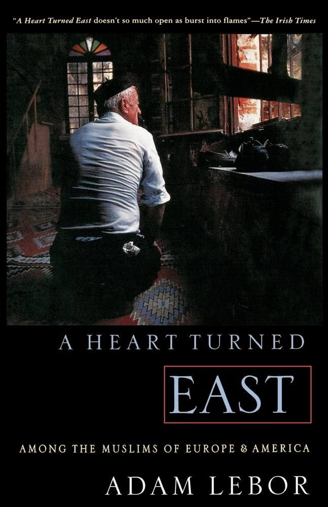Book cover of 'A Heart Turned East' with a man sitting in a room.