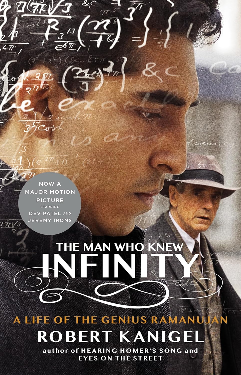 Book cover of 'The Man Who Knew Infinity' with a blurred image of two men and mathematical equations.