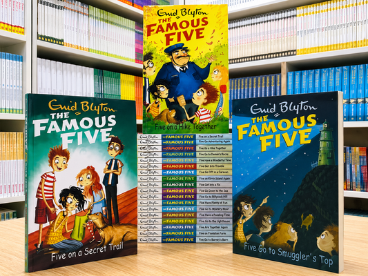 Three books from 'The Famous Five' series by Enid Blyton on a bookshelf.