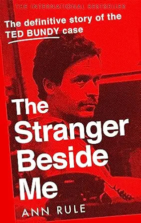 Book cover of 'The Stranger Beside Me' with a red background and portrait of a man.