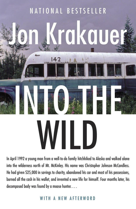 Book cover of 'Into the Wild' by Jon Krakauer with a bus and forest background.