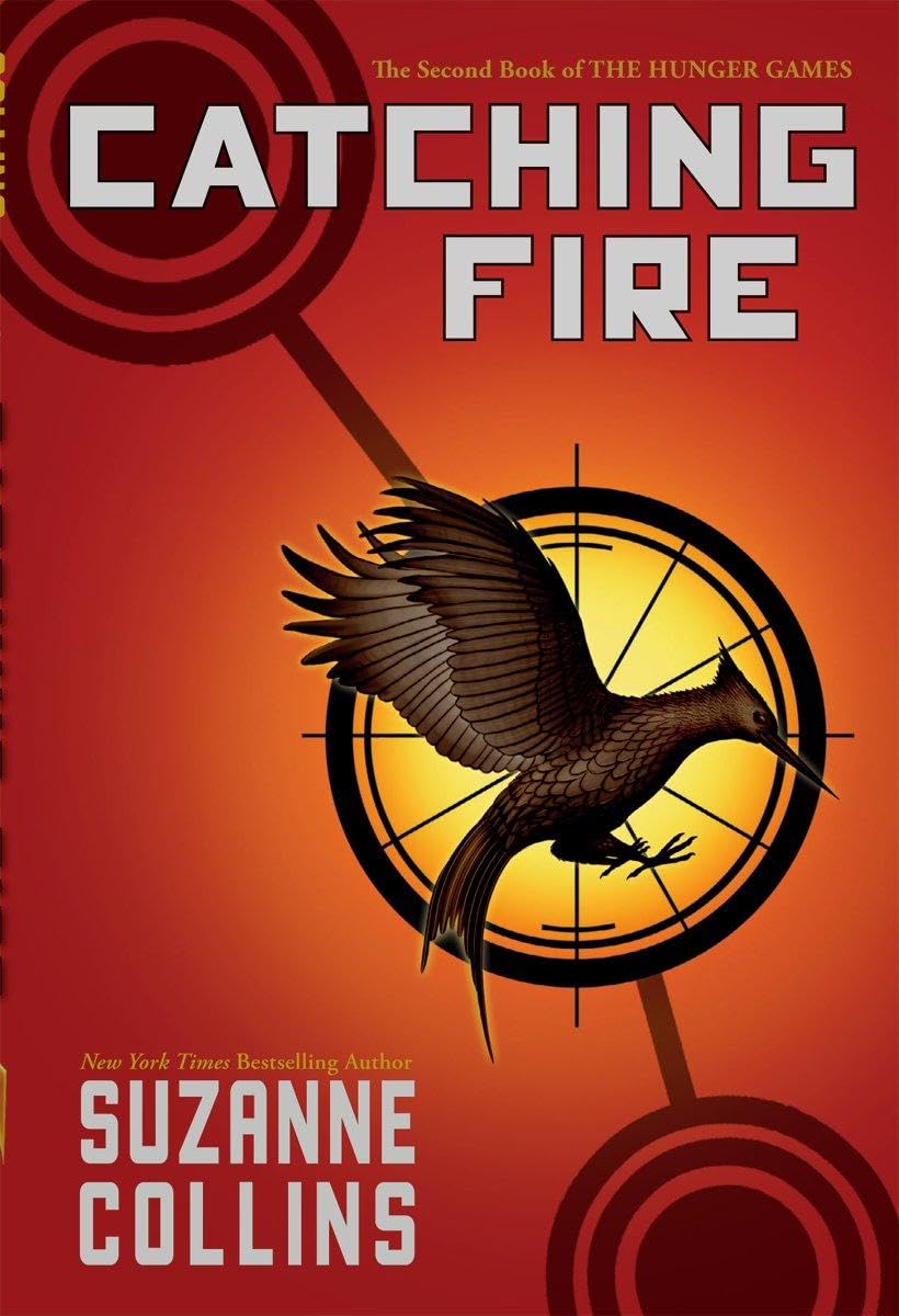 Book cover of 'Catching Fire' by Suzanne Collins