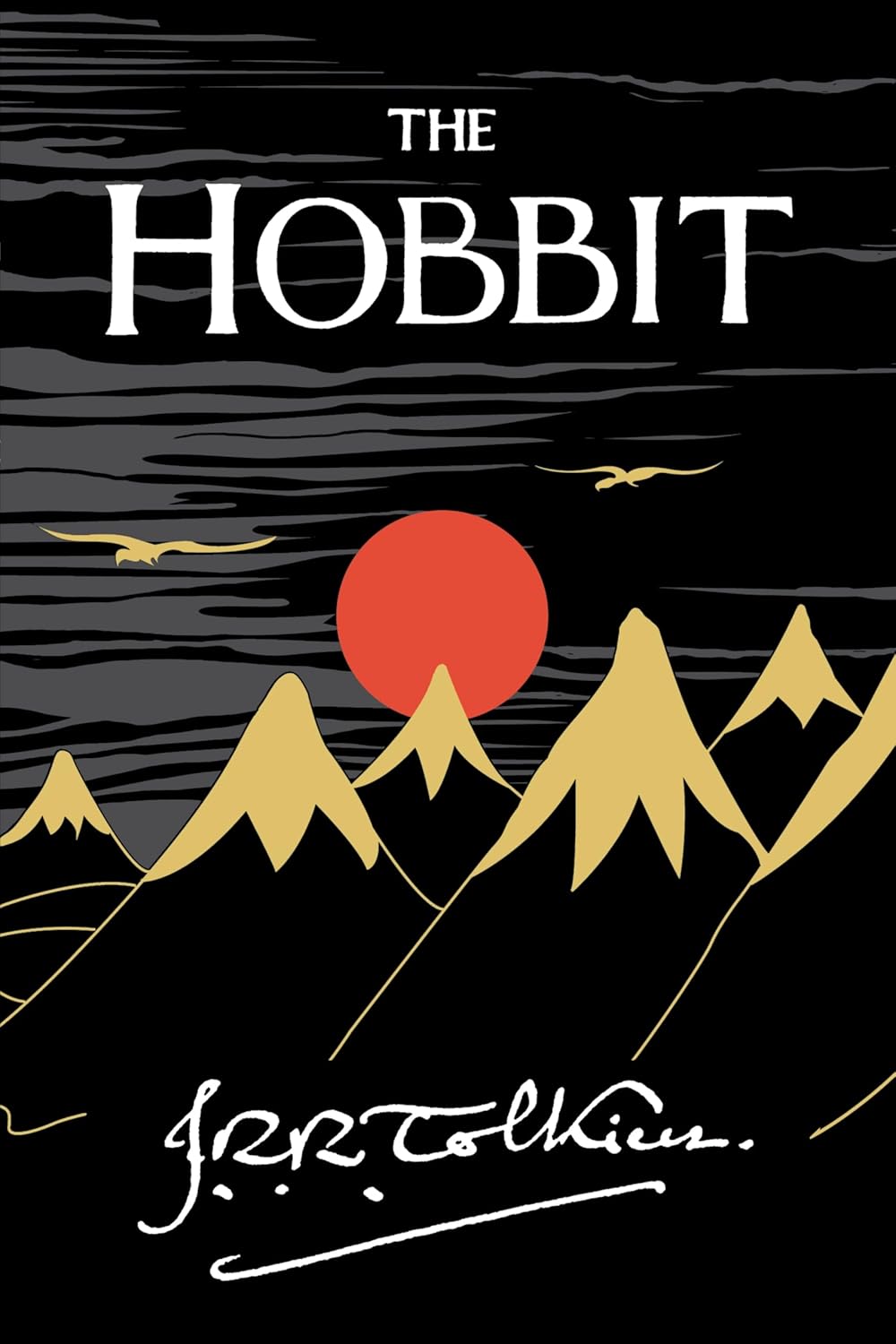 Book cover of 'The Hobbit' with mountains and a red sun on a black background