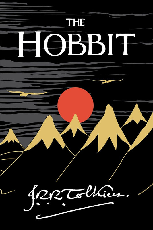 Book cover of 'The Hobbit' with mountains and a red sun on a black background