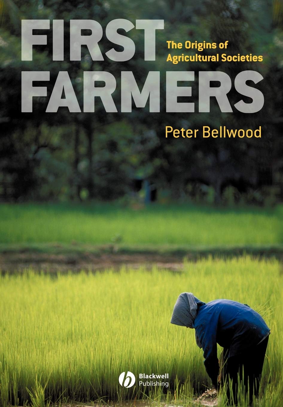 Book cover of 'First Farmers: The Origins of Agricultural Societies' by Peter Bellwood with a person working in a field.