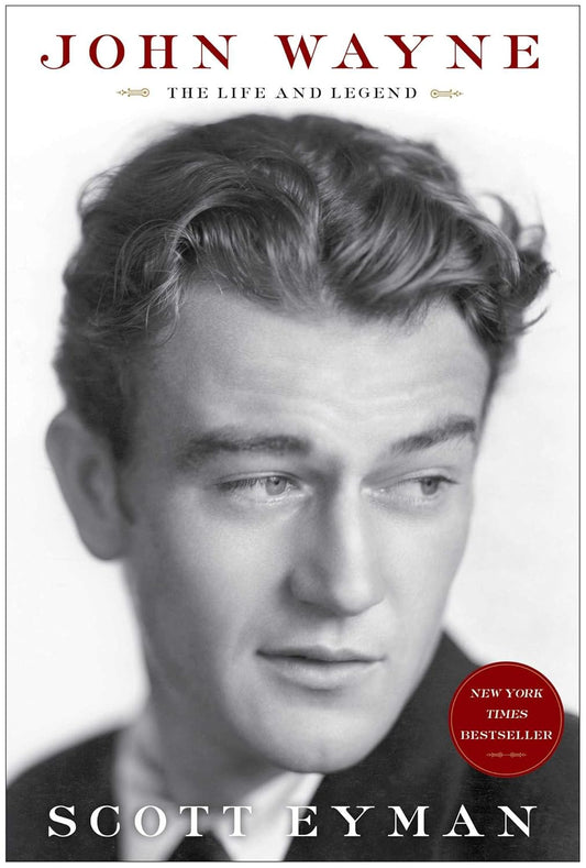 Book cover of 'John Wayne: The Life and Legend' by Scott Eyman with a black and white portrait of John Wayne.