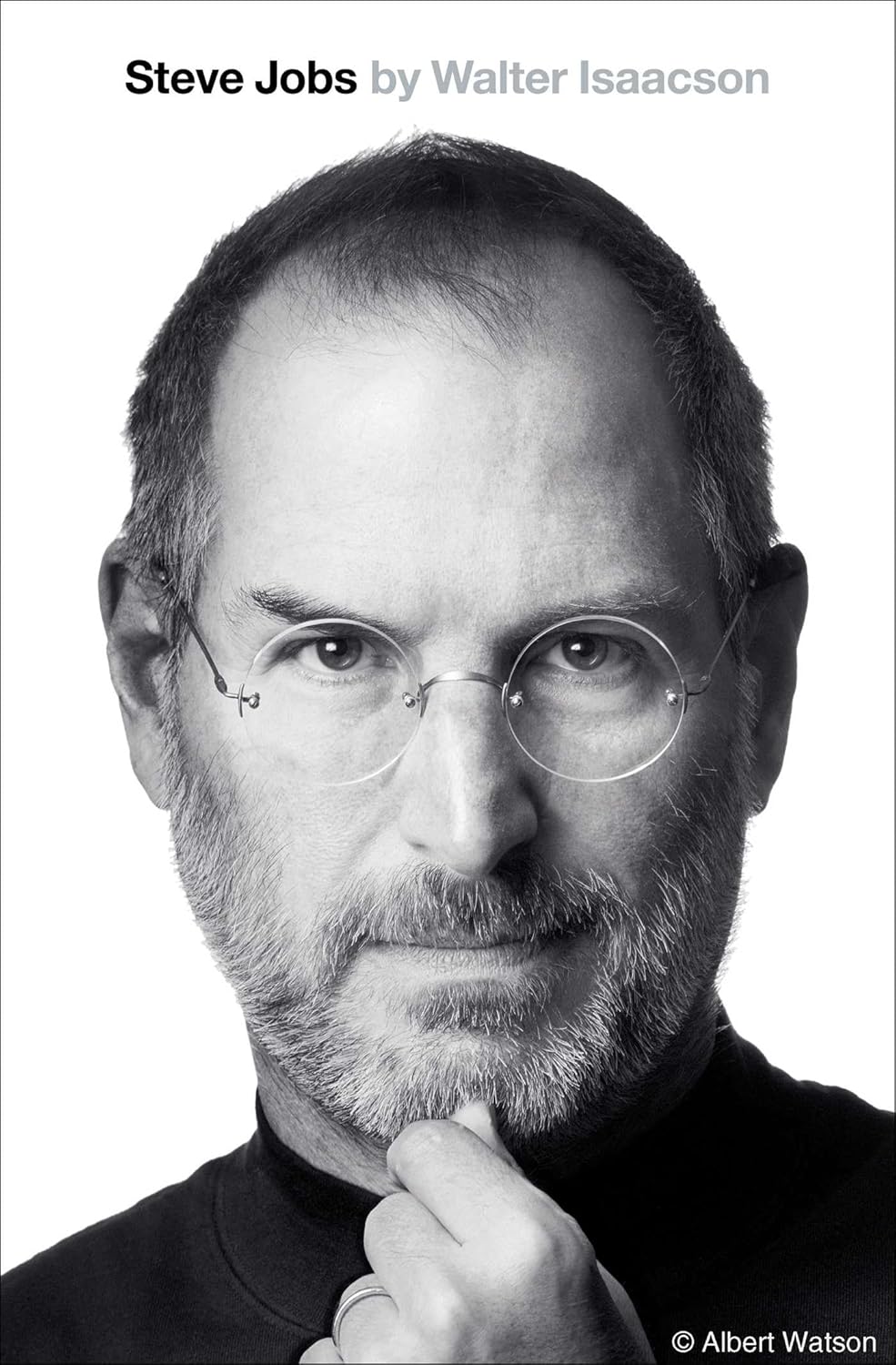 Black and white portrait of a famous person with text about the book 'Steve Jobs' by Walter Isaacson.