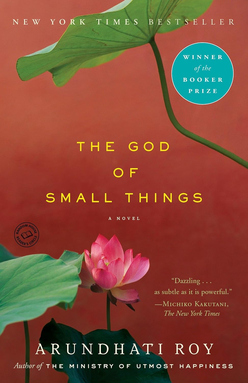 Book cover of 'The God of Small Things' with a pink flower and green leaves on a red background.