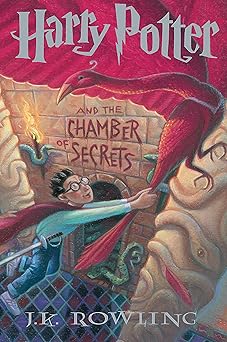Book cover of 'Harry Potter and the Chamber of Secrets' with a red broom and boy wizard illustration.