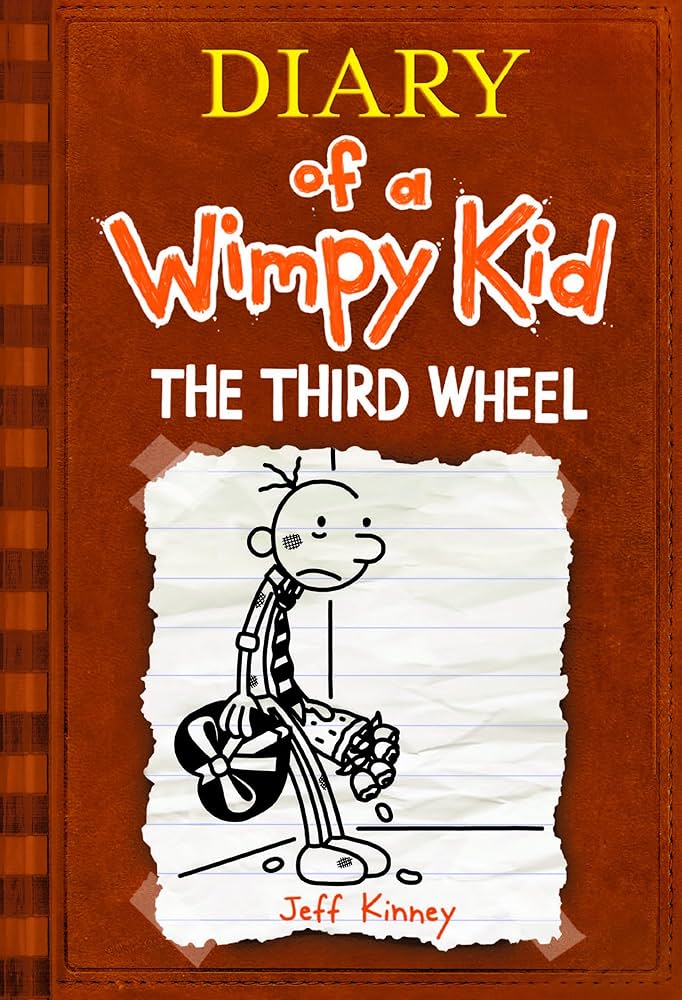 Book cover of 'Diary of a Wimpy Kid: The Third Wheel' by Jeff Kinney with a cartoon character on a brown background.