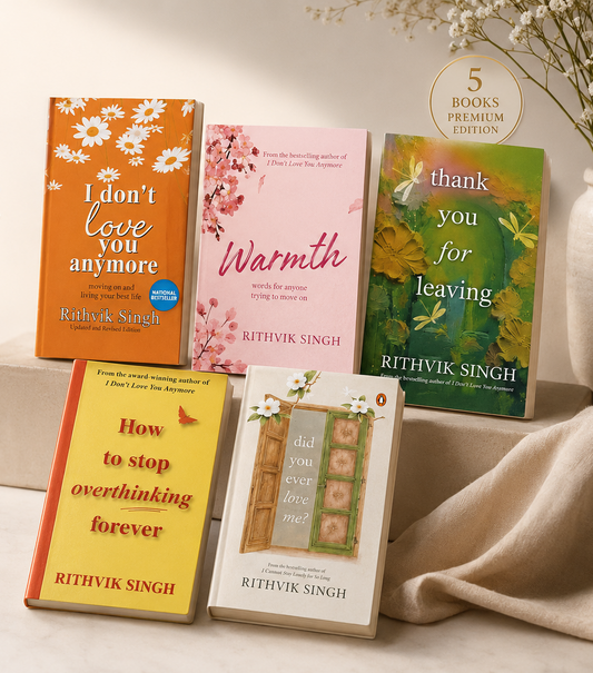 A promotional display of a 5-book premium book set titled 'Words That Heal & Inspire' by Rithvik Singh, arranged on a light beige surface with draped fabric and a vase of dried flowers. The books feature colorful covers in orange, pink, green, yellow, and white.